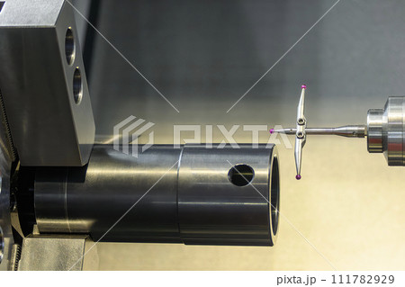 The modular touch probe checking the tube parts on CNC lathe machine. 111782929