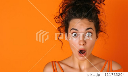 Portrait of attractive amazed girl sudden incredible news reaction wow isolated over bright orange color background 111783204
