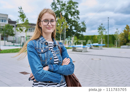 Portrait of teenage high school student girl with backpack, outdoor Portrait of teenage high school student girl with backpack, outdoor 111783705