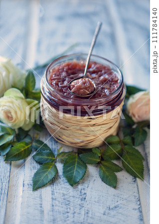 roses jam. food background with a glass jars full of tea rose jam 111784140
