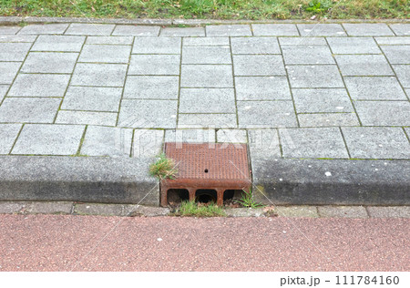 Manhole cover in a dutch street Manhole cover in a dutch street 111784160