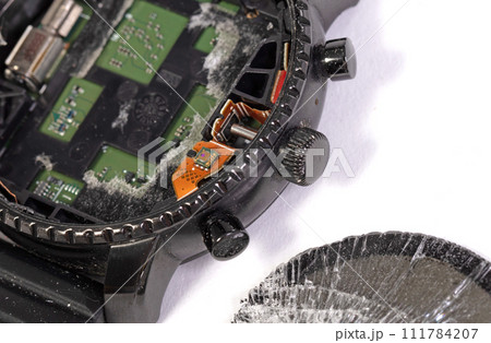 Broken smartwatch isolated on white background Broken smartwatch isolated on white background 111784207
