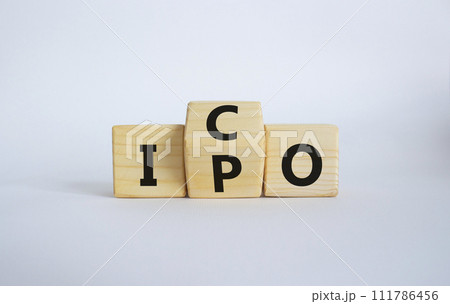 ICO and IPO symbol. Wooden cubes with words ICO - initial coin offering and IPO - initial public offering. Beautiful white background. Business concept. Copy space 111786456