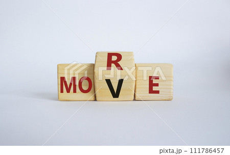 More Move symbol. Wooden cubes with words More Move. Beautiful white background. Business concept and More Move. Copy space More Move symbol. Wooden cubes with words More Move. Beautiful white background. Business concept and More Move. Copy space 111786457