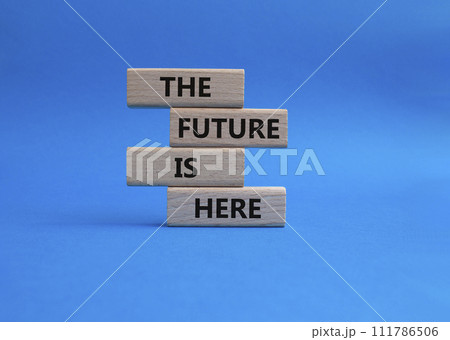 The future is here symbol. Concept words The future is here on wooden blocks. Beautiful blue background. Business and The future is here concept. Copy space. 111786506