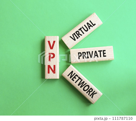 VPN - Virtual Private Network. Wooden cubes with word VPN. Beautiful green background. Business and VPN concept. Copy space. 111787110