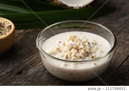 Job's tears in Sweet Coconut Milk,Boiled millet with coconut soup in glass bowl. 111789052