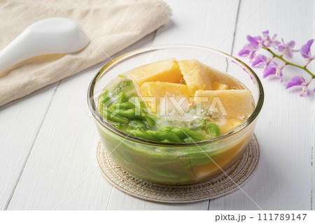 Muskmelon and Chendol In Sweet Coconut Milk And Ice in glass bowl,Pandan Noodles with Coconut Milk and thai melon(Lod Chong Tang Thai) Muskmelon and Chendol In Sweet Coconut Milk And Ice in glass bowl,Pandan Noodles with Coconut Milk and thai melon(Lod Chong Tang Thai) 111789147