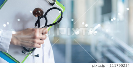 Doctor with stethoscope and folders of documents stands . Doctor with stethoscope and folders of documents stands . 111790234
