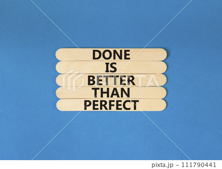 Done is better than perfect symbol. Concept words Done is better than perfect on wooden stick. Beautiful blue table blue background. Business, done is better than perfect concept. Copy space. Done is better than perfect symbol. Concept words Done is better than perfect on wooden stick. Beautiful blue table blue background. Business, done is better than perfect concept. Copy space. 111790441