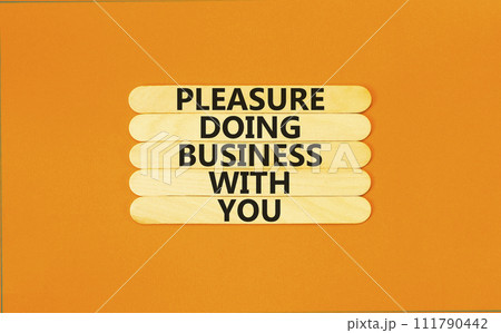 Pleasure doing business with you symbol. Concept words Pleasure doing business with you on wooden stick. Beautiful orange table orange background. Pleasure doing business with you concept. Copy space. 111790442