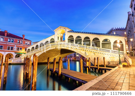Famous Rialto Bridge of Venice on the Grand Canal at twilight, Italy. Famous Rialto Bridge of Venice on the Grand Canal at twilight, Italy. 111790666