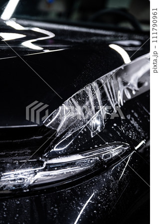 Black car protected with clear PPF Paint Protection Film 111790961