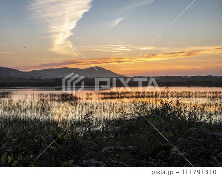 Sunset at Clooney Lake in Narin by Portnoo, County Donegal - Ireland 111791310
