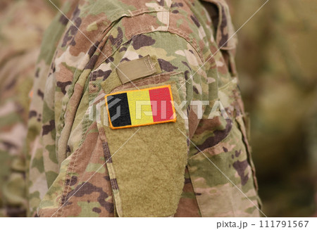Flag of Belgium on soldiers arm (collage). Flag of Belgium on soldiers arm (collage). 111791567