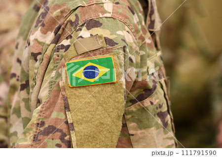 Brazil flag on soldiers arm. Brazil troops (collage) Brazil flag on soldiers arm. Brazil troops (collage) 111791590
