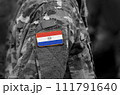 Flag of Paraguay on soldier arm. Flag of Paraguay on military uniforms (collage). 111791640