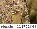 Suriname flag on soldiers arm. Suriname army (collage) 111791644