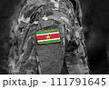Flag of Suriname on soldier arm. Flag of Suriname on military uniforms (collage). 111791645