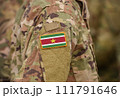 Flag of Suriname on soldiers arm (collage). 111791646