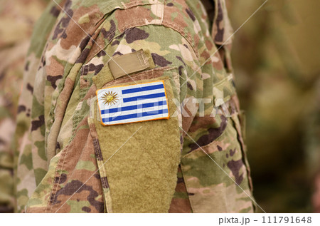 Uruguay flag on soldiers arm. Uruguay troops (collage) 111791648