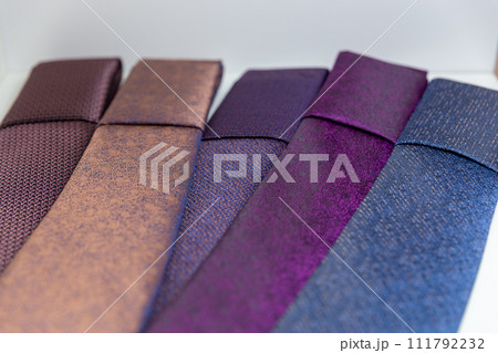 Classic neckties on shelf in boutique. 111792232