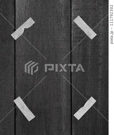 Artistic representation of an anonymous person with taped eyes on wooden texture Artistic representation of an anonymous person with taped eyes on wooden texture 111792302