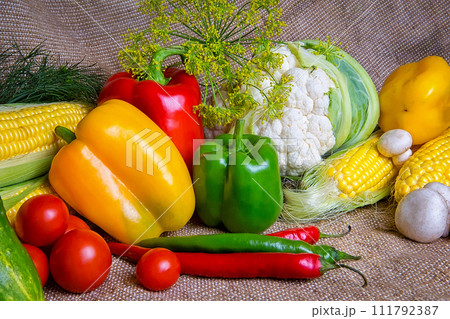 vegetables, vegetables on the table. corn, cauliflower, tomatoes, champignons, chili peppers vegetables, vegetables on the table. corn, cauliflower, tomatoes, champignons, chili peppers 111792387