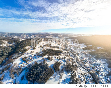 Tanvald in wintertime. Small town in Jizera Mountains, Czechia. Aerial photography from above. Tanvald in wintertime. Small town in Jizera Mountains, Czechia. Aerial photography from above. 111793111