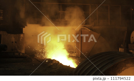 Liquid metal from blast furnace. Liquid iron from ladle in the steelworks 111794522
