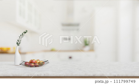 A close-up shot of a white marble kitchen tabletop with empty space in a modern white kitchen. 111799749