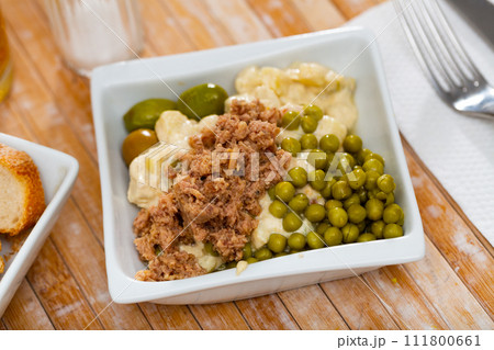 Spanish salad called Ensalada rusa 111800661