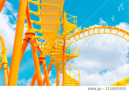 Rollercoaster railroad track high to the sky roll bend and twist for exciting fun at theme park Rollercoaster railroad track high to the sky roll bend and twist for exciting fun at theme park 111805920