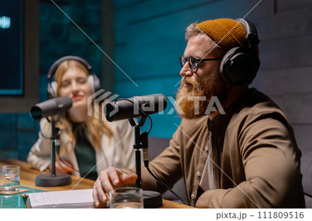 Young people in podcast studio. Recording a new radio show. 111809516