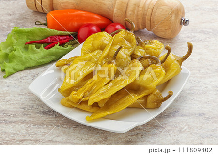 Pickled marinated spicy green pepper Pickled marinated spicy green pepper 111809802