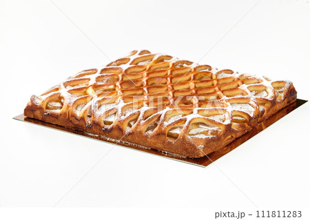 Lattice apple galette with custard sprinkled with powdered sugar Lattice apple galette with custard sprinkled with powdered sugar 111811283