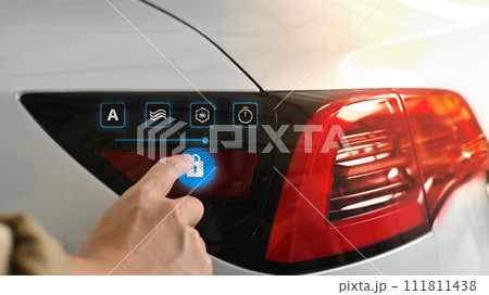 Man pressing unlock key button icon, opened charging socket cap of an electric car Man pressing unlock key button icon, opened charging socket cap of an electric car 111811438