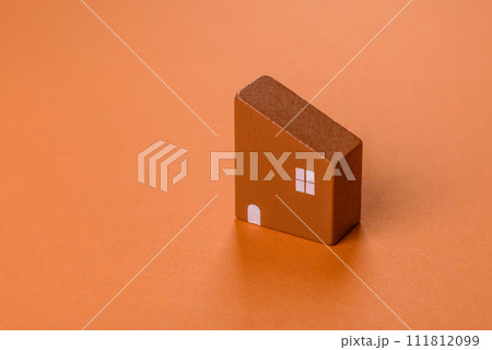 A small wooden house, money and keys as an idea for investing in your own home 111812099