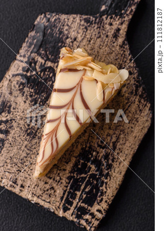 Piece of delicious sweet esterhazy cake with nuts and cream 111812187