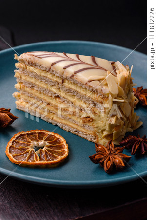 Piece of delicious sweet esterhazy cake with nuts and cream 111812226