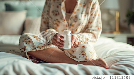 AI-generated content. An elderly woman holds bottle of medicinal tablets, vitamins while sitting on her bed in bedroom. Women's health, prevention of psychological diseases 111813505
