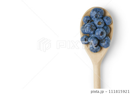 Fresh blueberries in wooden spoon isolated on white background with copy space 111815921