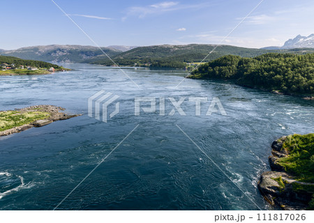 Captured from above, the dynamic Saltstraumen tide contrasts with serene Nordic scenery 111817026