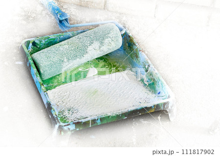 Painter craftsman artist tray,roller for painting,workplace with green paint Painter craftsman artist tray,roller for painting,workplace with green paint 111817902