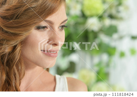 Portrait of beautiful woman posing at home 111818424