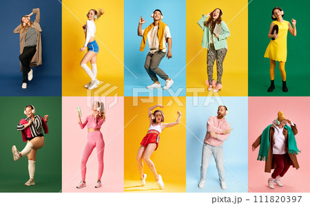 Creative collage made of full-length portraits of people listening music in headphones and dancing against multicolored studio background. 111820397
