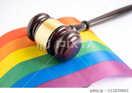 Gavel for judge lawyer on rainbow flag, symbol of LGBT pride month celebrate annual in June social of gay, lesbian, bisexual, transgender, human rights. 111820661
