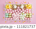 Easter sweet charcuterie board with chocolate eggs on pink background. Top view. 111821737