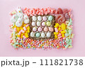 Easter sweet charcuterie board with chocolate eggs on pink background. Top view. 111821738