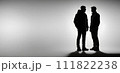 Silhouette of two men looking at each other 111822238